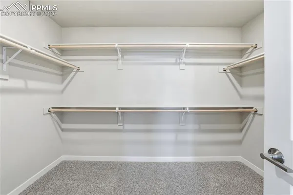 a view of an empty walk in closet