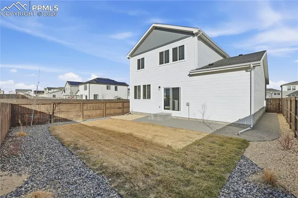 a house view with a backyard space