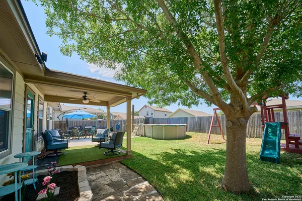 a view of a house with a yard porch and sitting area