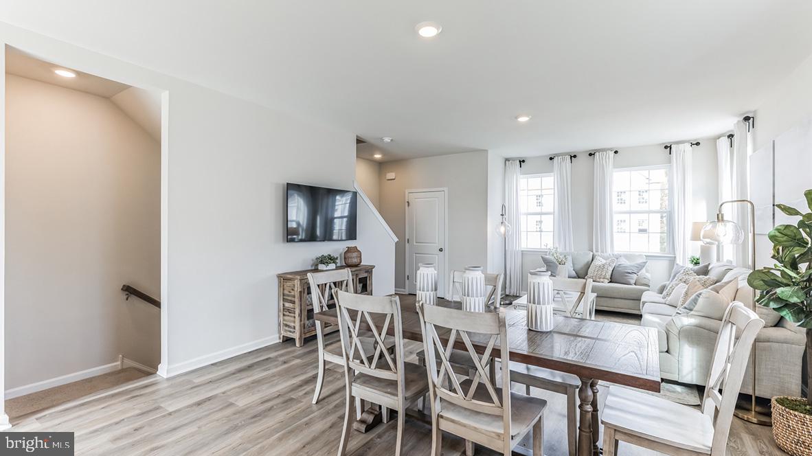 3080 Martha Way Pennsburg, PA 18073 - Photo 9 of 24 a view of a dining room with furniture and wooden floor