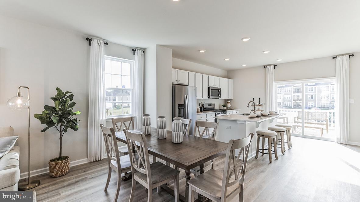 3080 Martha Way Pennsburg, PA 18073 - Photo 10 of 24 a view of a dining room with furniture window and wooden floor