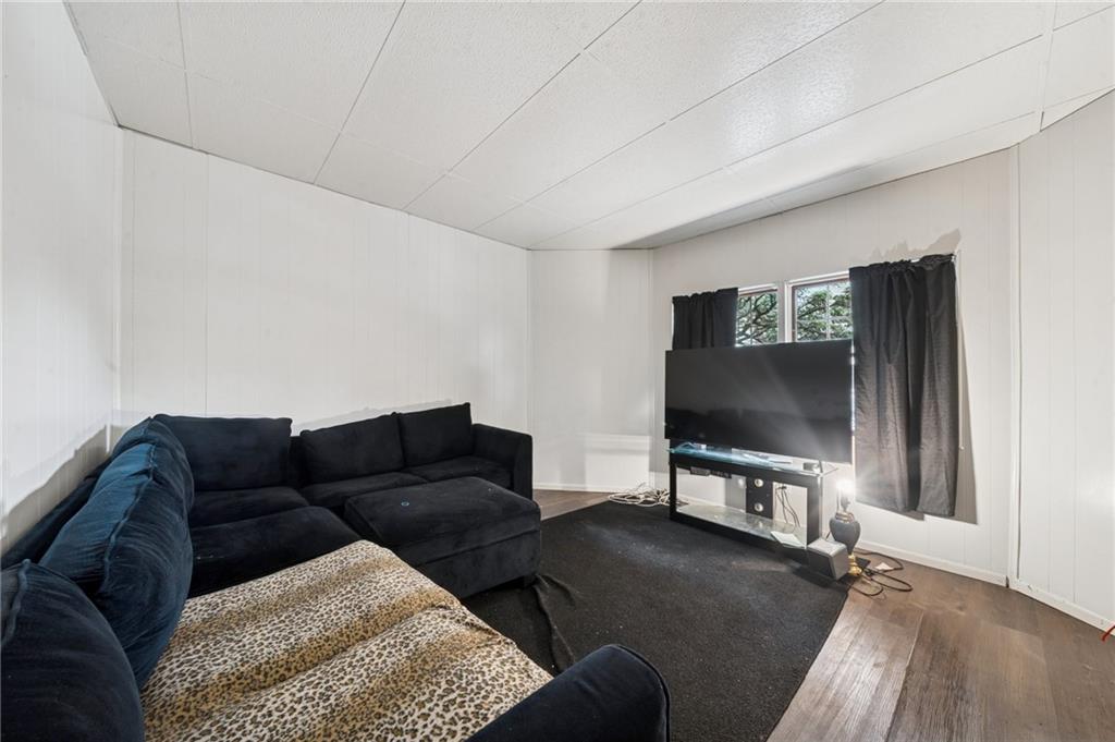 425 Agatha Street Pitcairn, PA 15140 - Photo 12 of 34 a living room with furniture and a flat screen tv