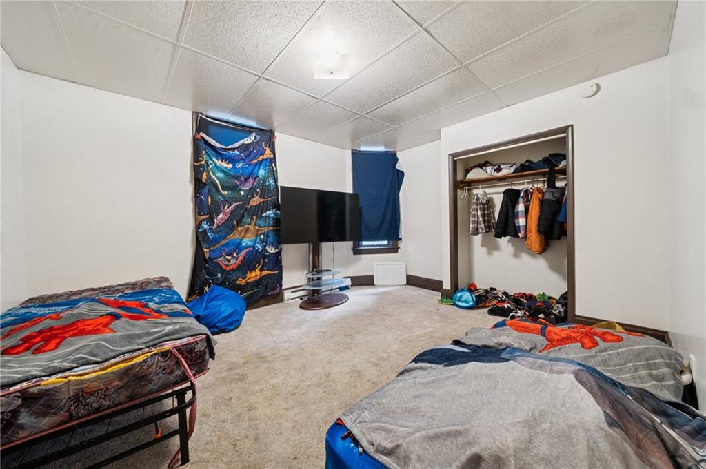 425 Agatha Street Pitcairn, PA 15140 - Photo 16 of 34 a bedroom with bed and a flat screen tv