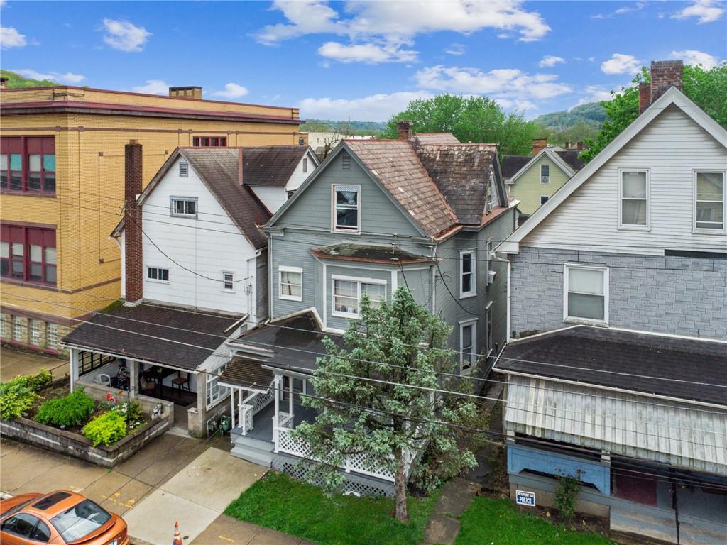 425 Agatha Street Pitcairn, PA 15140 - Photo 2 of 34 a front view of a house with a garden