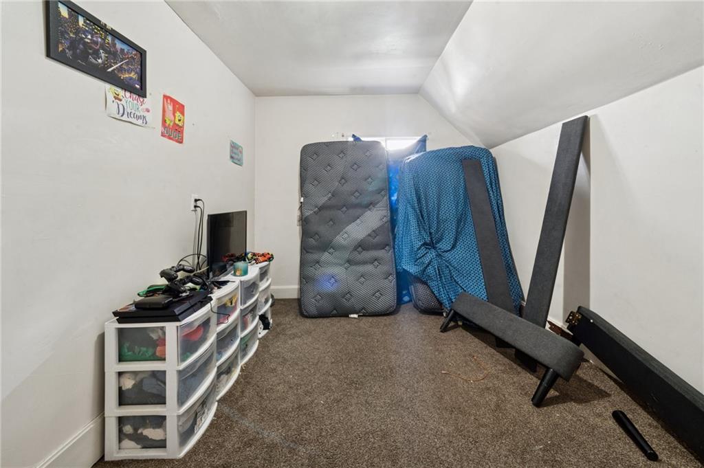 425 Agatha Street Pitcairn, PA 15140 - Photo 24 of 34 a room with furniture and a flat screen tv