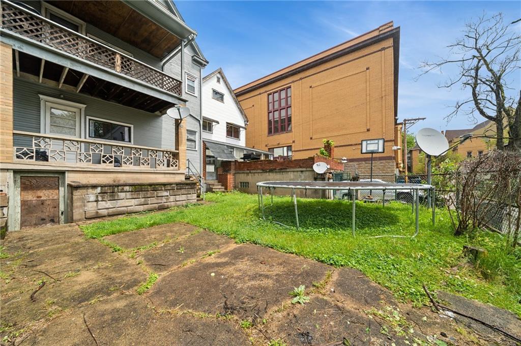 425 Agatha Street Pitcairn, PA 15140 - Photo 30 of 34 a view of backyard with seating area and green space
