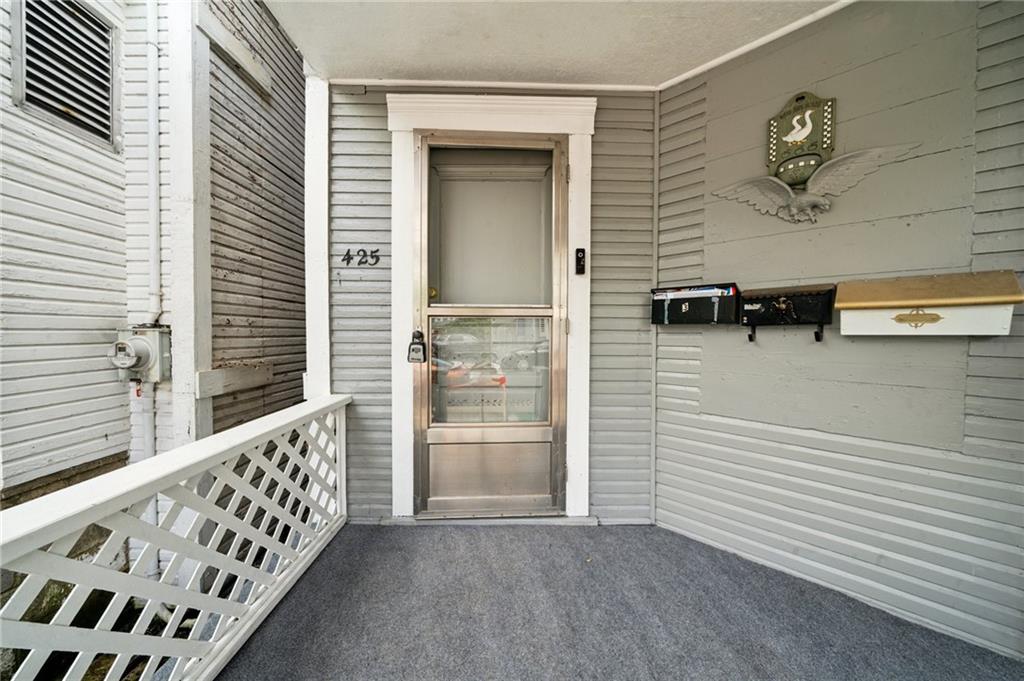 425 Agatha Street Pitcairn, PA 15140 - Photo 3 of 34 a view of a porch with wooden floor