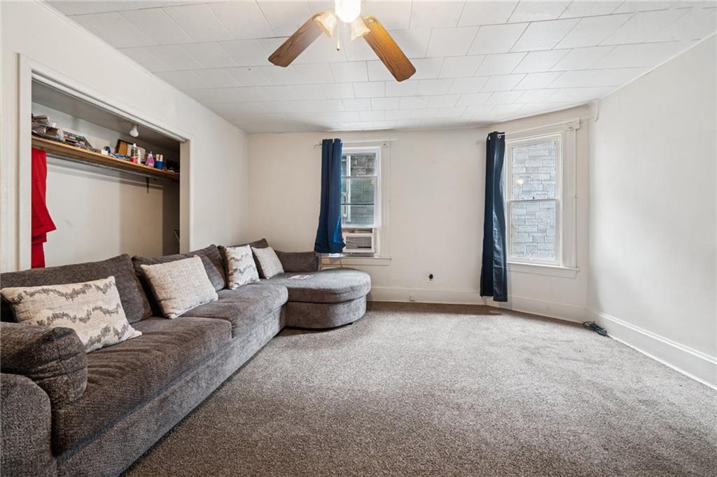 425 Agatha Street Pitcairn, PA 15140 - Photo 7 of 34 a living room with furniture and a window