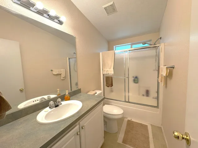 a view of yard with wooden fence