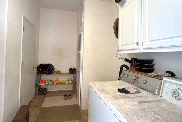 a view of outdoor space with swimming pool and trees in the background