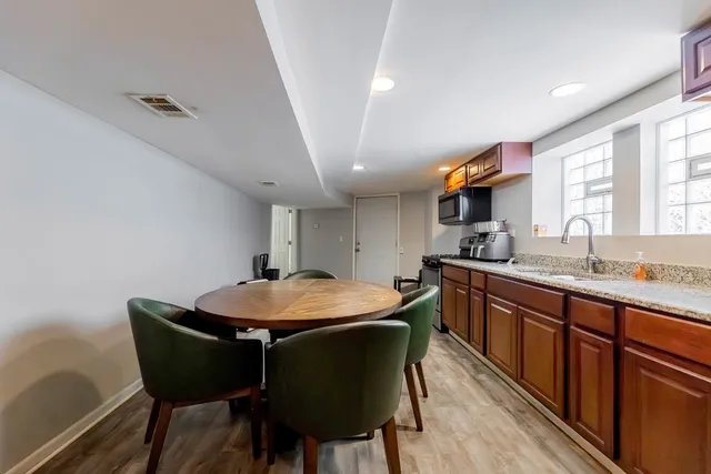 a dining room with a granite countertop furniture and kitchen view