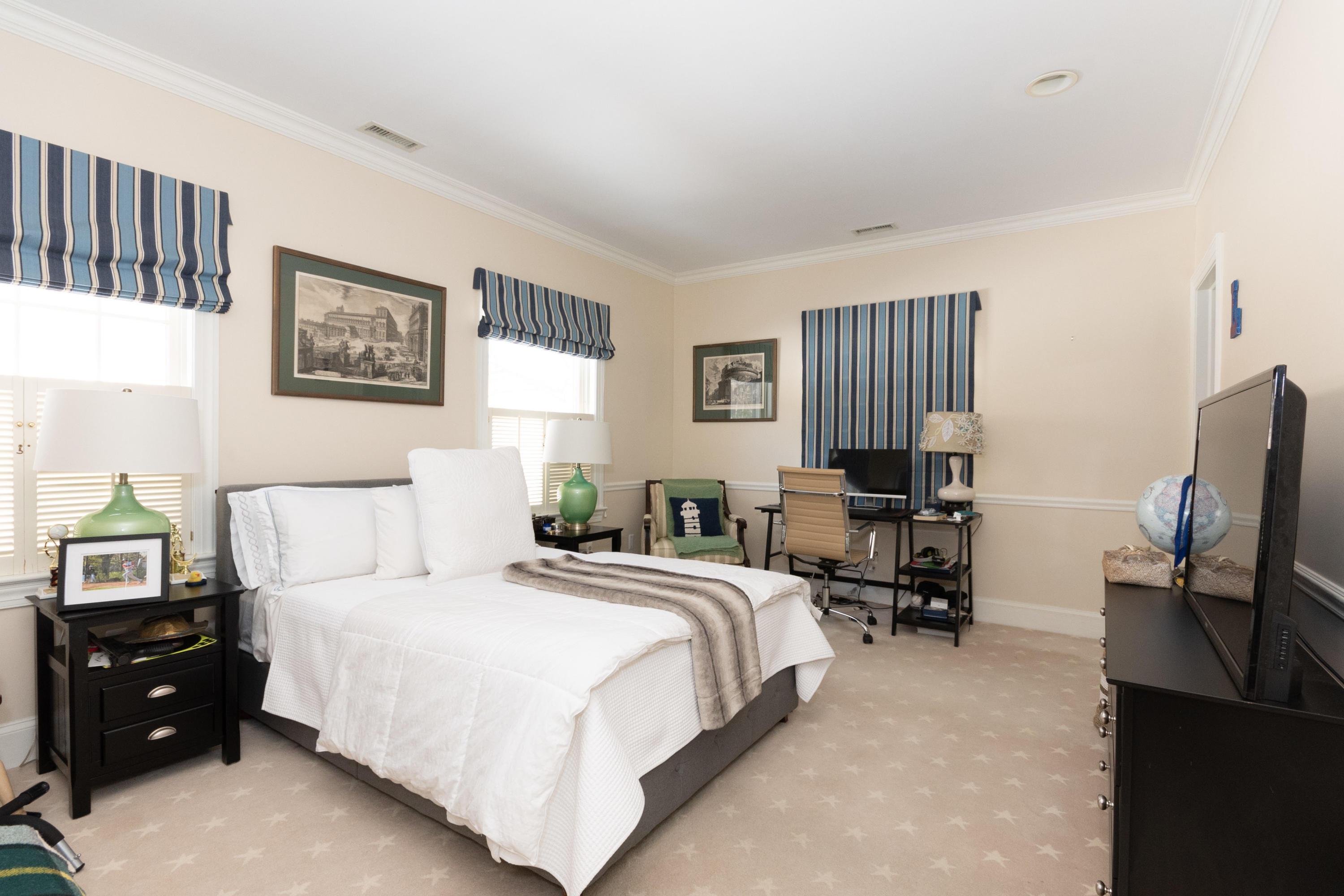 123 Lone Tree Farm Road New Canaan, CT 06840 - Photo 20 of 22 a bedroom with a bed tv and a large window