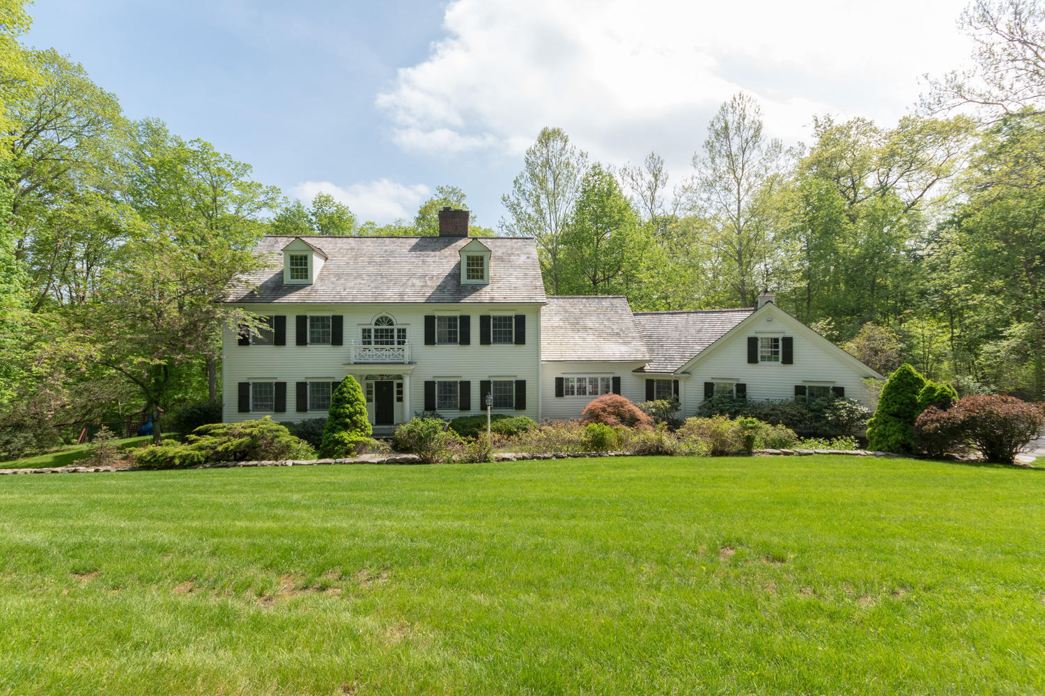 123 Lone Tree Farm Road New Canaan, CT 06840 - Photo 21 of 22 a front view of house with yard and green space