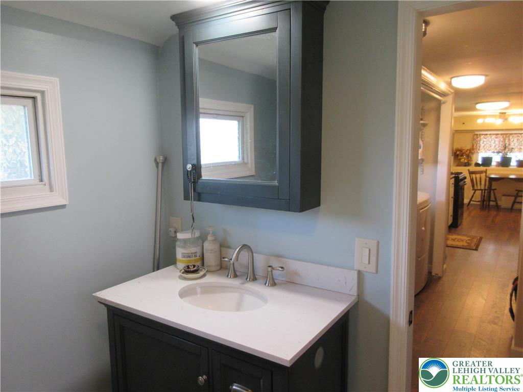 246 Poplar Street Bath, PA 18014 - Photo 16 of 20 a en suite bathroom with a sink and a mirror