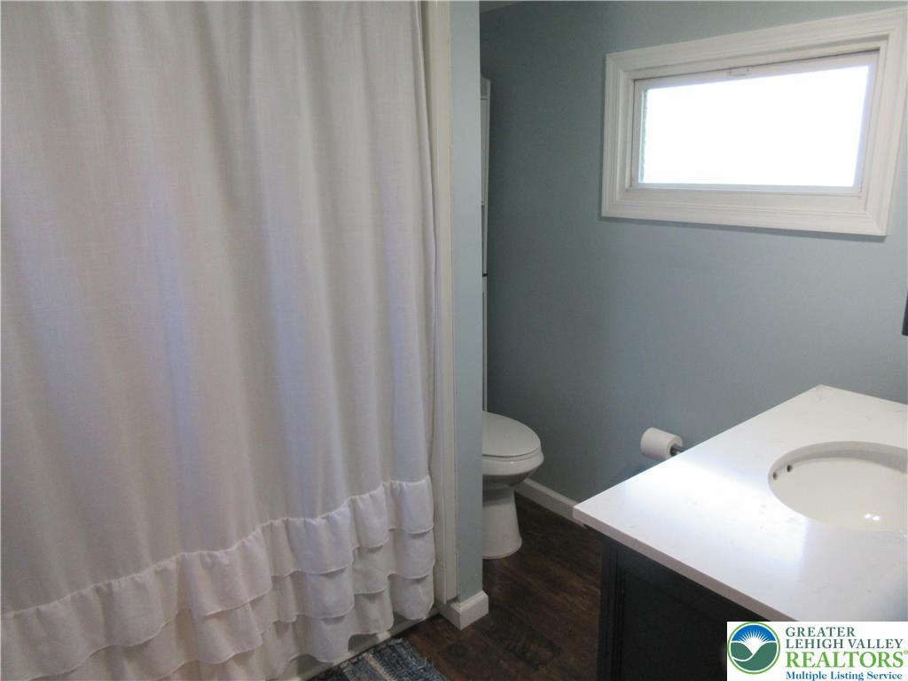 246 Poplar Street Bath, PA 18014 - Photo 17 of 20 a bathroom with a toilet and a sink