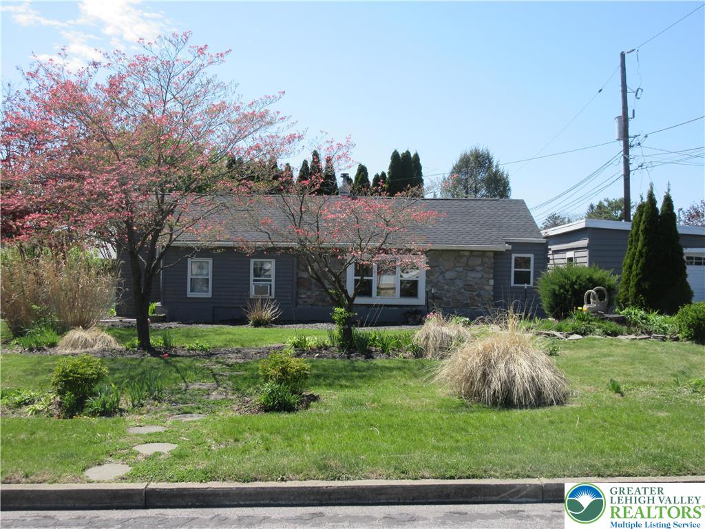 246 Poplar Street Bath, PA 18014 - Photo 5 of 20 a front view of a house with a garden and trees