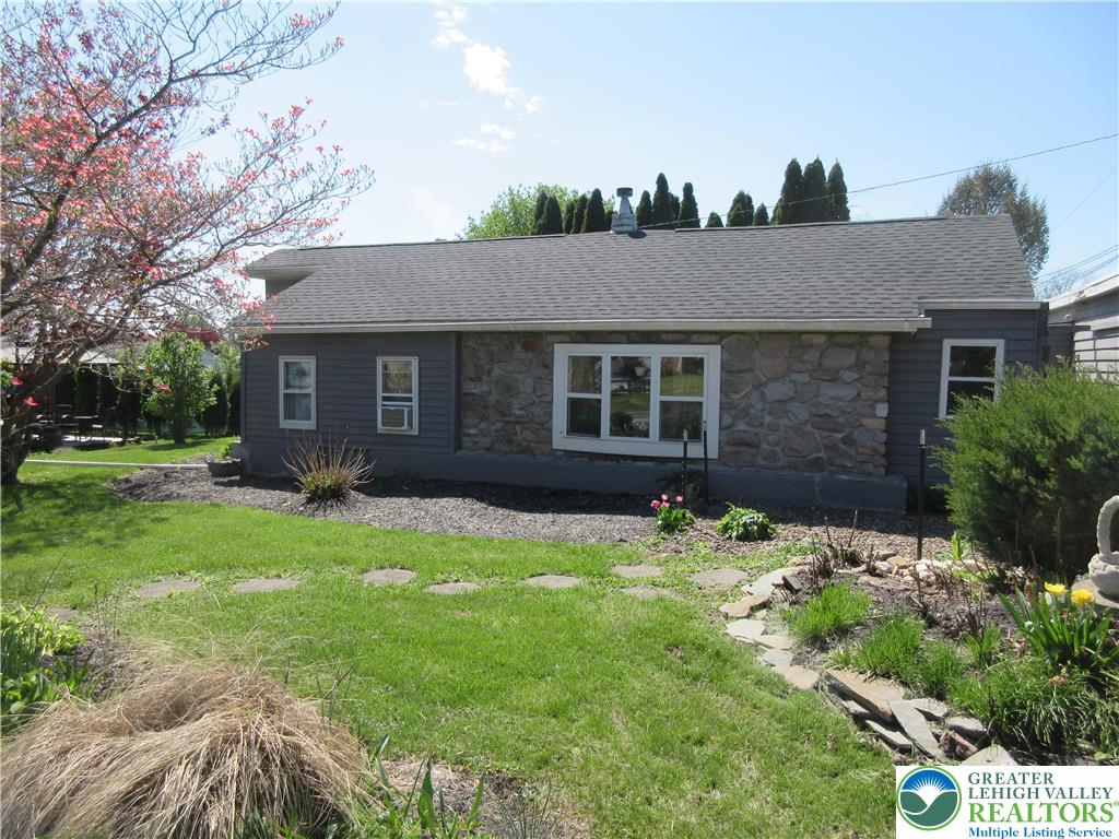 246 Poplar Street Bath, PA 18014 - Photo 6 of 20 a backyard of a house with table and chairs