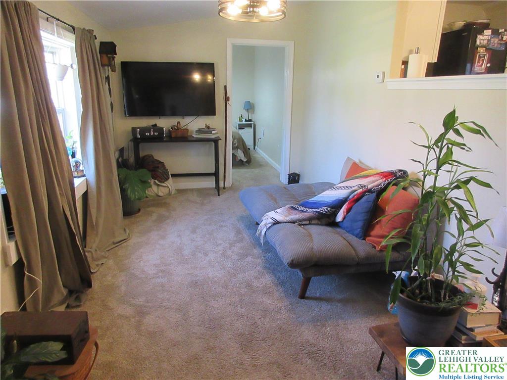 246 Poplar Street Bath, PA 18014 - Photo 8 of 20 a living room with furniture and a flat screen tv