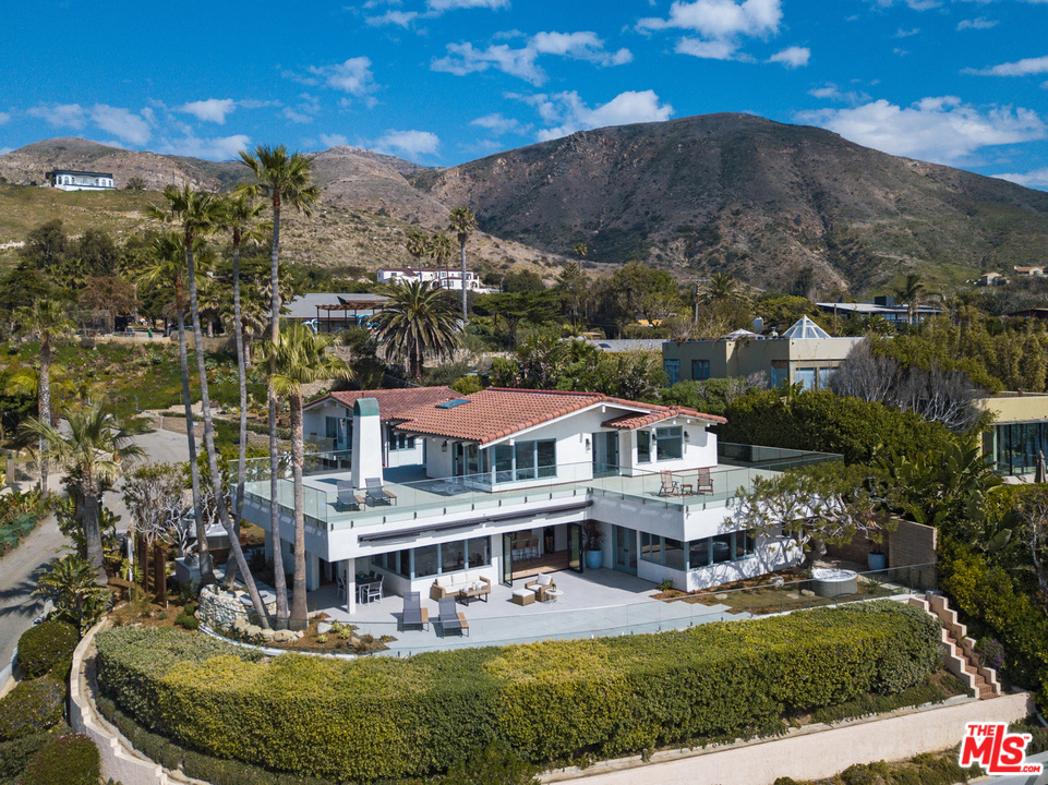 32054 Pacific Coast Highway Malibu, CA 90265 - Photo 1 of 48 a view of a house with a big yard