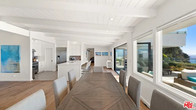 a view of a living room and a balcony