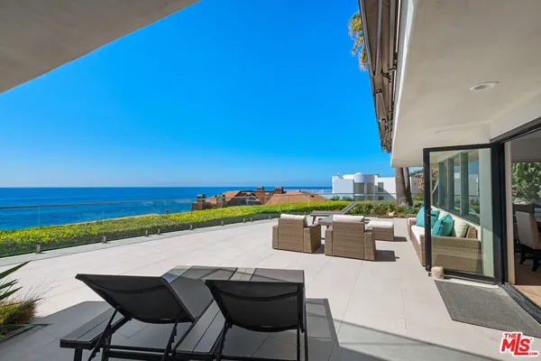 a view of swimming pool with outdoor seating
