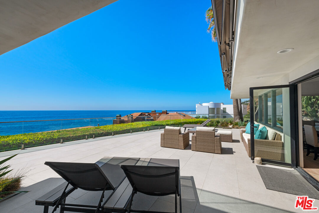 32054 Pacific Coast Highway Malibu, CA 90265 - Photo 19 of 48 a view of a swimming pool and an outdoor seating
