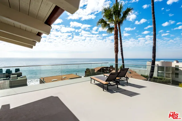 a view of a terrace with outdoor seating