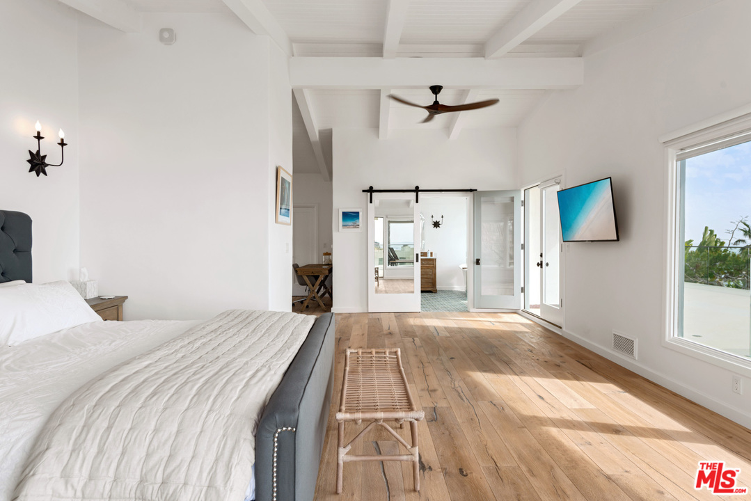 32054 Pacific Coast Highway Malibu, CA 90265 - Photo 29 of 48 a bedroom with a bed and a window