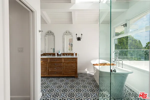 a room with glass door and furniture