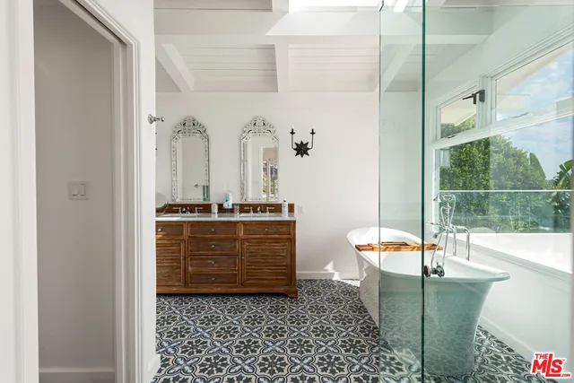 a room with glass door and furniture