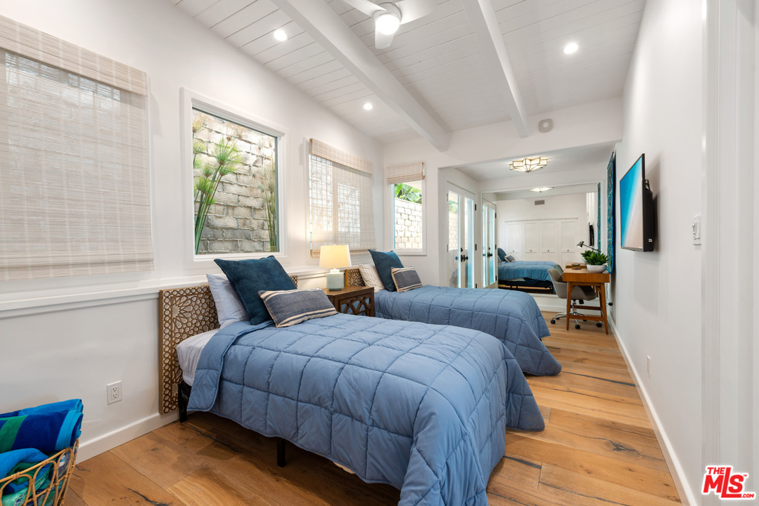 32054 Pacific Coast Highway Malibu, CA 90265 - Photo 34 of 48 a bed room with two bed and a large window