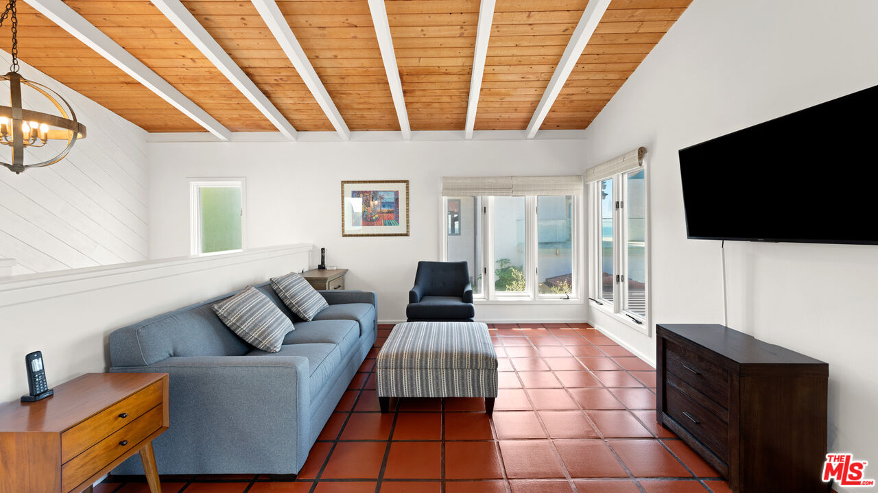 32054 Pacific Coast Highway Malibu, CA 90265 - Photo 40 of 48 a living room with furniture and a flat screen tv