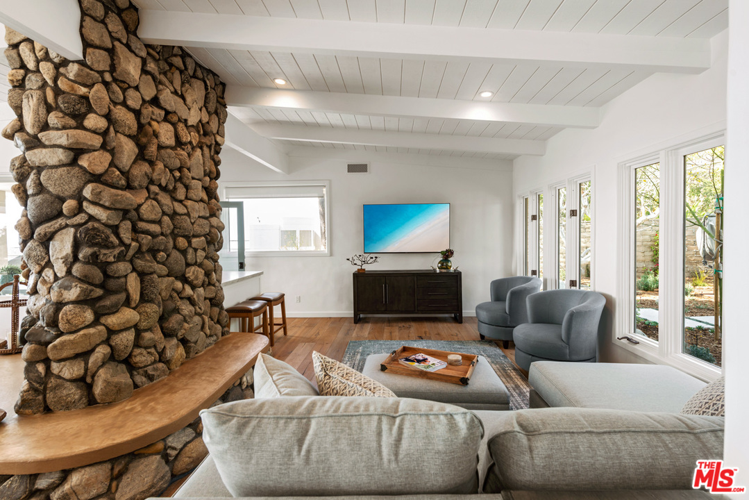 32054 Pacific Coast Highway Malibu, CA 90265 - Photo 7 of 48 a living room with furniture and a flat screen tv