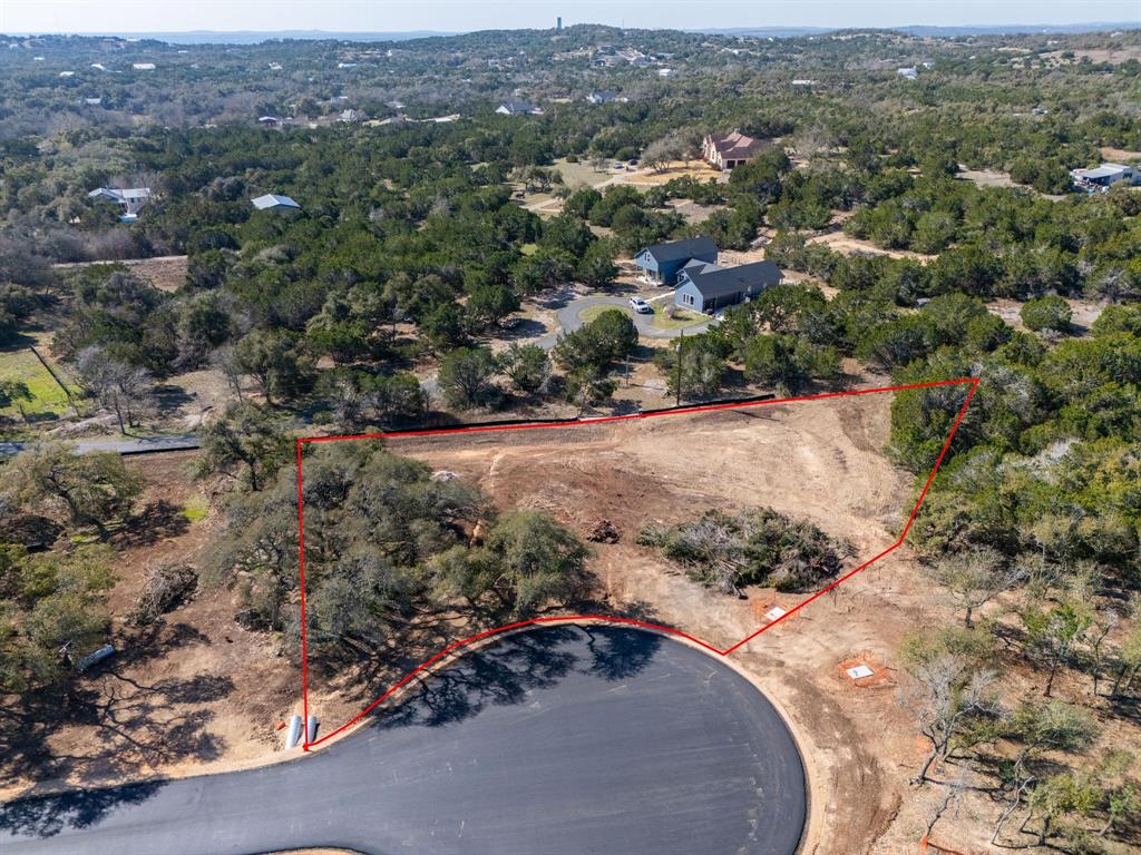 Lot7 Springlake Drive Dripping Springs, TX 78620 - Photo 2 of 9 an aerial view of a house with a yard