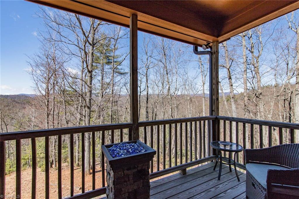 308 Warren Way Purlear, NC 28665 - Photo 12 of 29 One of two Covered Porches off the back of the house with beautiful views of the Blue Ridge Parkway in the distance.