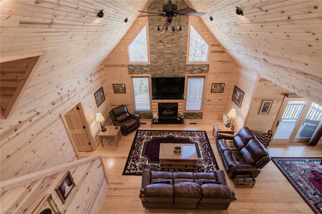 308 Warren Way Purlear, NC 28665 - Photo 8 of 29 Great Room with soaring pine ceilings and beautiful stone, gas log fireplace.