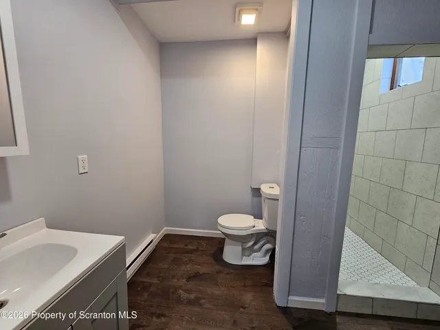 a bathroom with a toilet and a sink