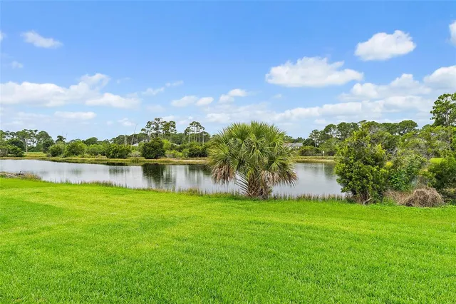 a view of a lake with a building in the background
