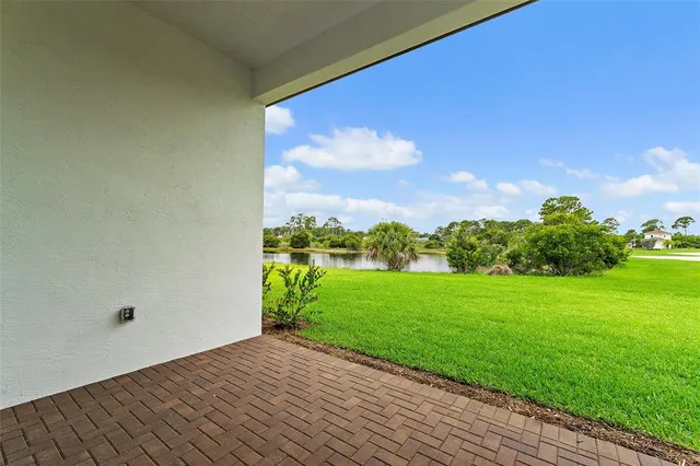 a view of a backyard of the house