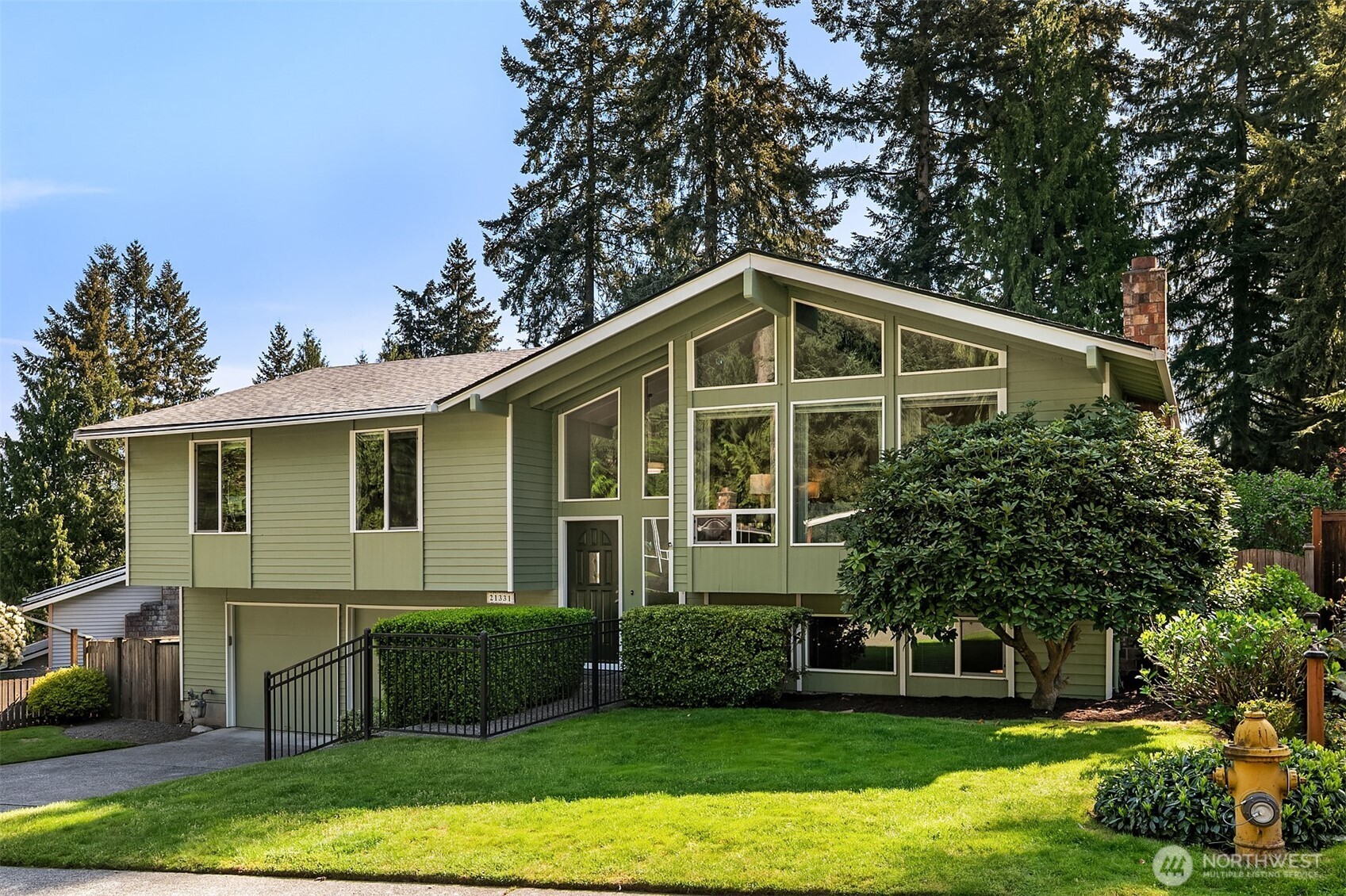21331 2nd Avenue Southeast Bothell, WA 98021 - Photo 33 of 34 a front view of a house with a yard