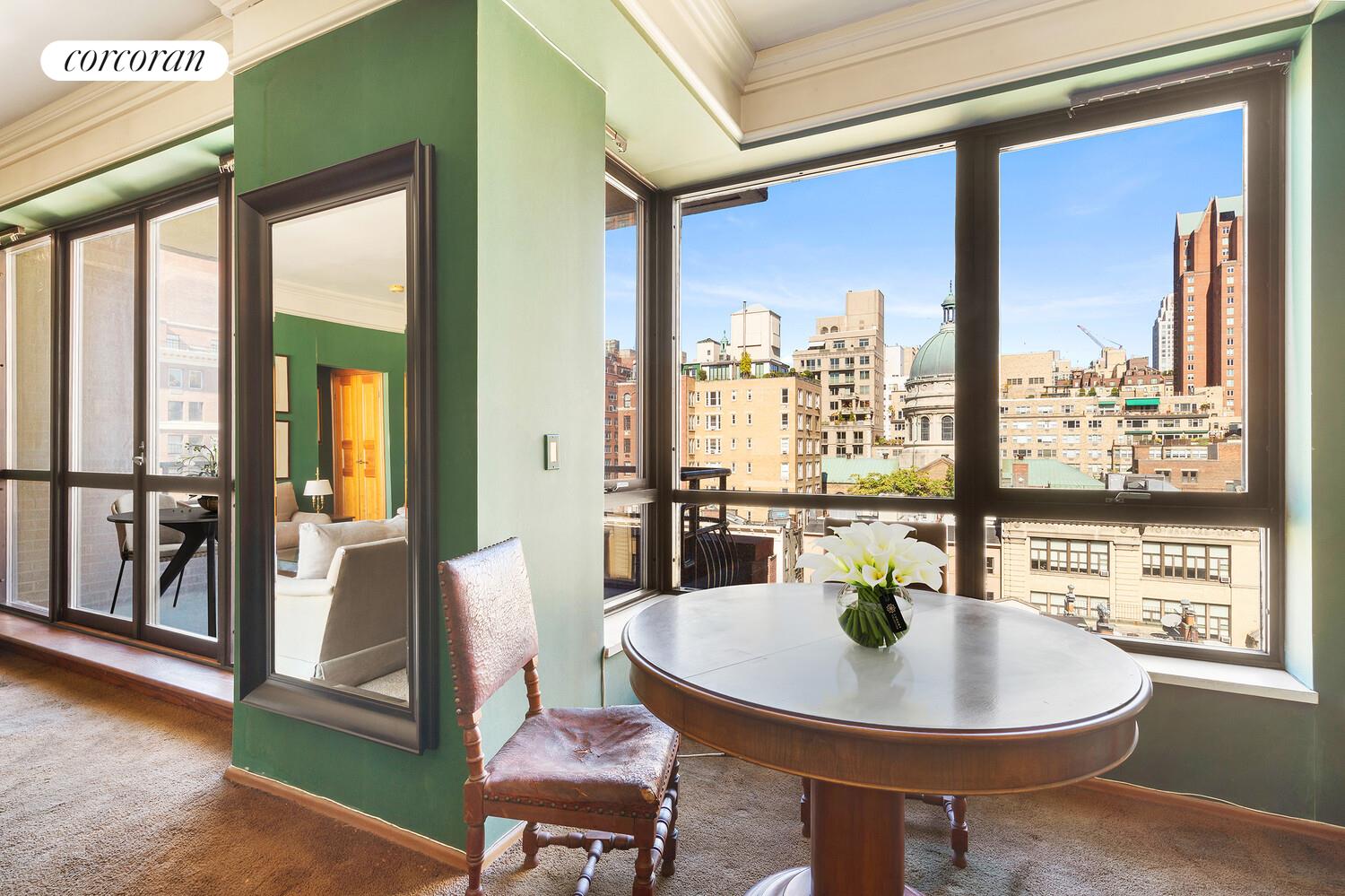 157 East 74th Street, Unit 9B Manhattan, NY 10021 - Photo 3 of 9 a view of a dining room with furniture window and wooden floor
