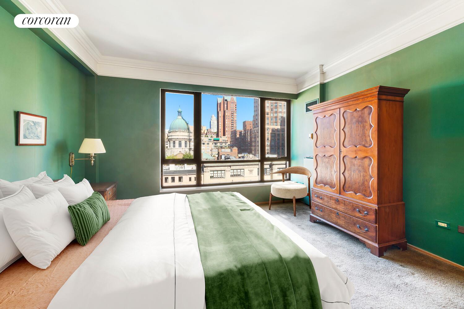 157 East 74th Street, Unit 9B Manhattan, NY 10021 - Photo 6 of 9 a bedroom with a bed and a large window