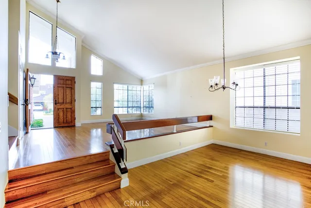 a view of an entryway with wooden floor and a window