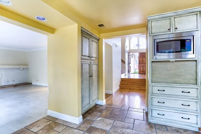 a view of walk in closet with fireplace and cabinet