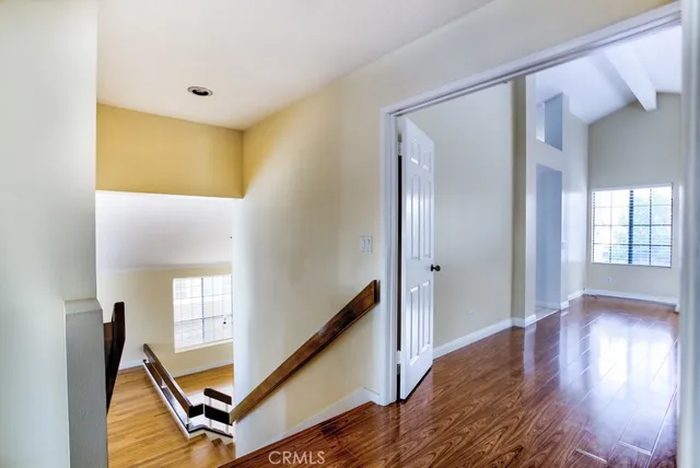 a view of an entryway with wooden floor