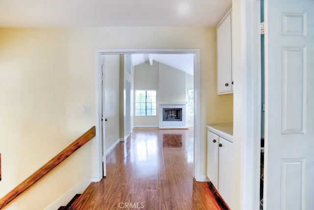 a view of hallway with wooden floor