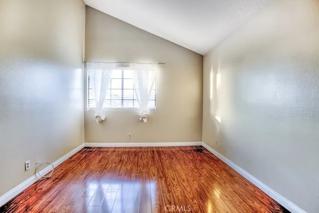 a view of hallway with wooden floor