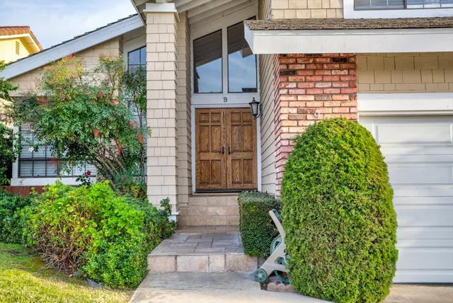 a front view of a house with garden