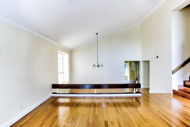a view of a room with wooden floor