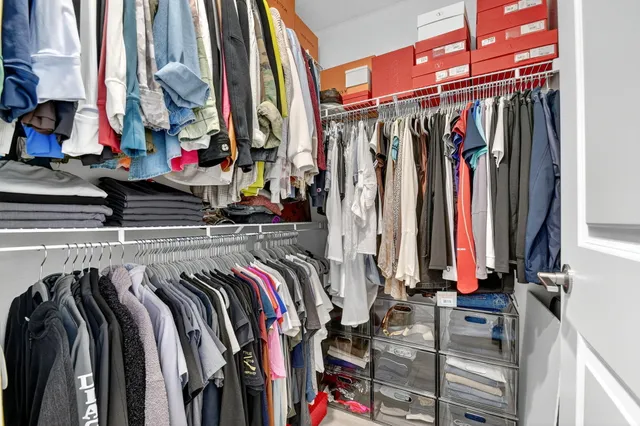 a bathroom with a double vanity sink mirror and shower